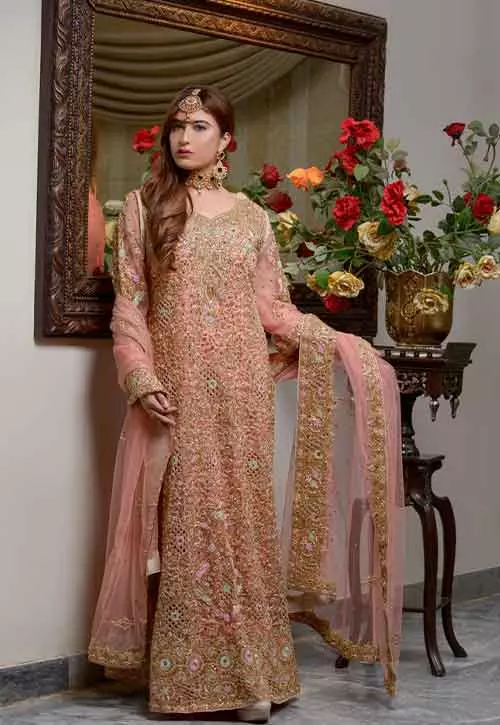A zari and stone embroidered pink suit for reception for Indian brides