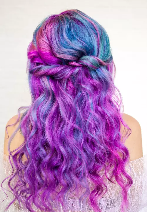 A woman with mermaid galaxy hair color