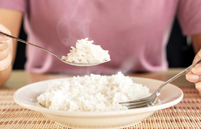 Woman following the BRAT diet and eating rice