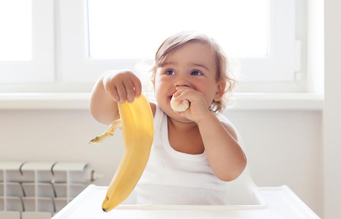 Toddler following the BRAT diet and eating banana