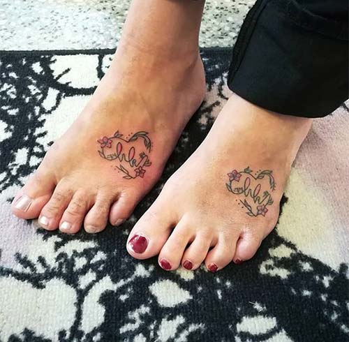 Mother and daughter matching foot tattoos