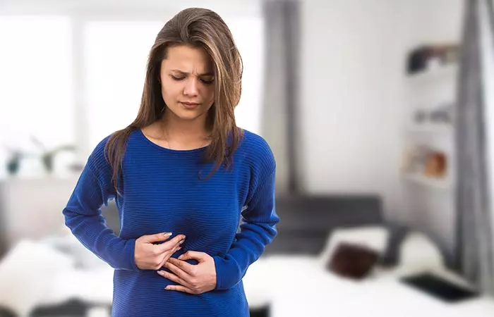 Woman having stomach pain due to digestive issues