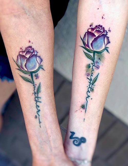 Matching half flower tattoos for mother and daughter