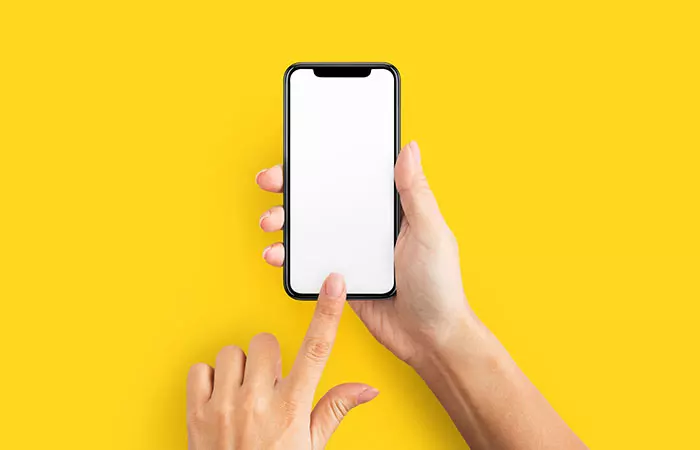 Holding Phone In One Hand And Using The Index Finger Of The Other Hand To Type And Scroll