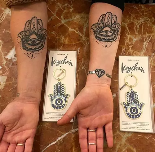 Mother and daughter matching hamsa tattoos