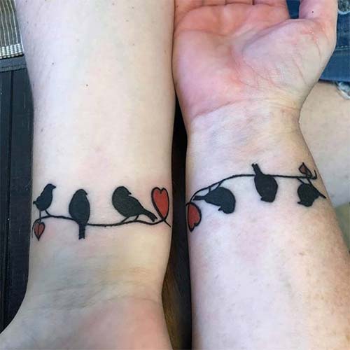 Mother and daughter matching wrist tattoos