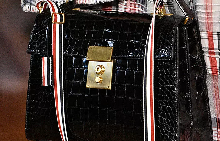 Thom Browne Three-strap small crocodile bag is an expensive leather handbag