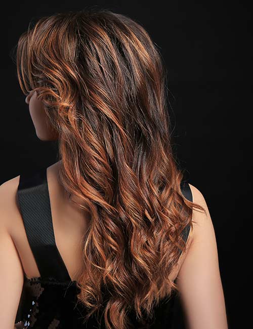 Add caramel highlights to your long brown hair
