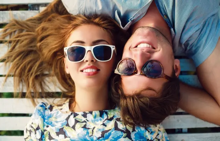 A cute couple lying on the deck
