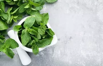 Green coffee with mint leaves