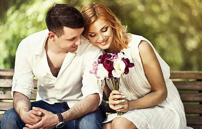 A man gives flowers to his girlfriend before confessing his love