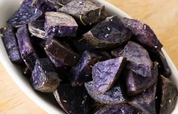 Get purple potatoes benefits with a delicious serving of purple potato roast with garlic