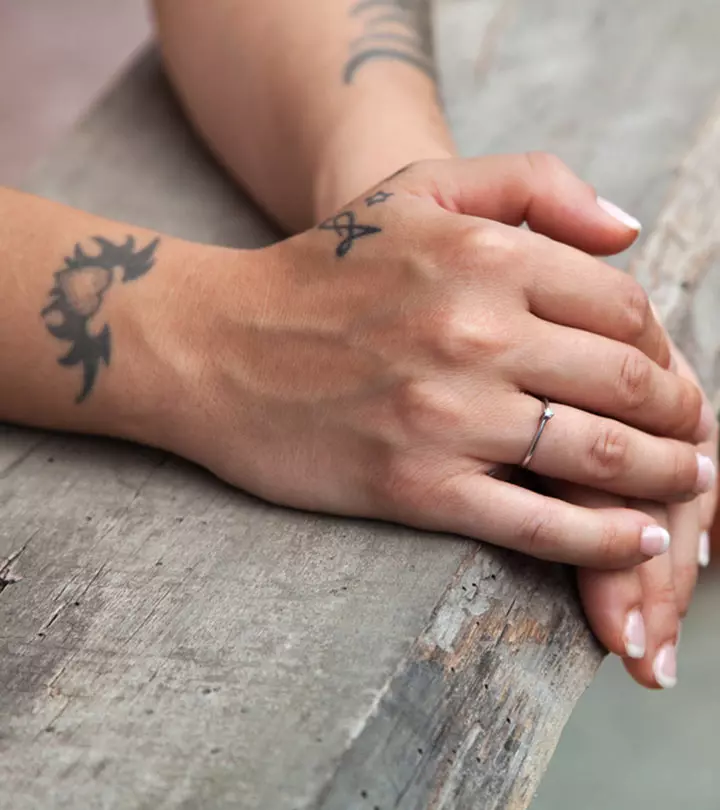 A woman with a heart tattoo on her wrist