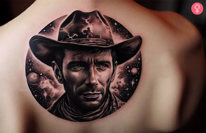 A man with a space cowboy tattoo on his upper back