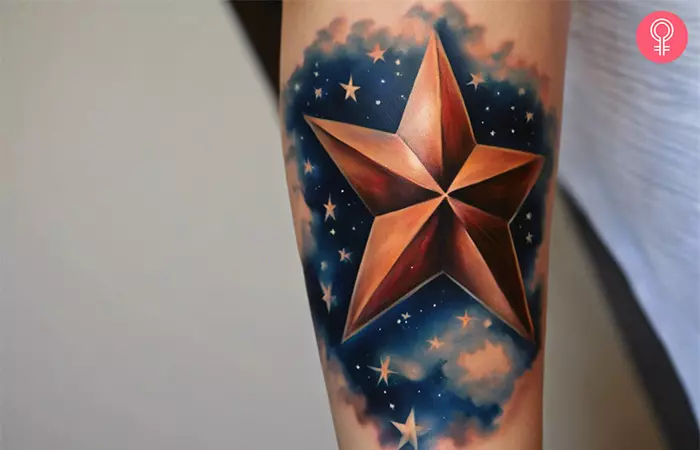 A woman with a colored 3D space tattoo design on her upper arm