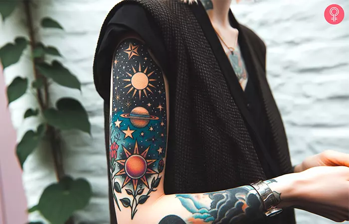 A woman with a traditional colored space tattoo design on her upper arm