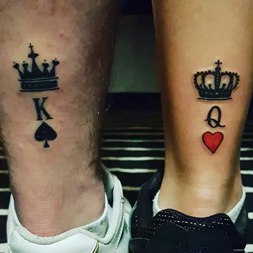 King and queen tattoos with letters k and q and crowns on the ankle