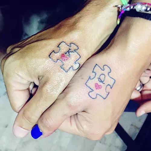 Two red hearts and letters k and q for king and queen tattoos