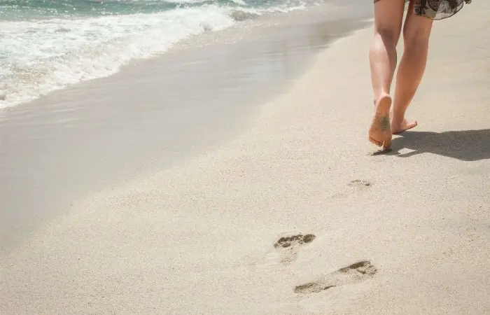 A woman walking on a beach