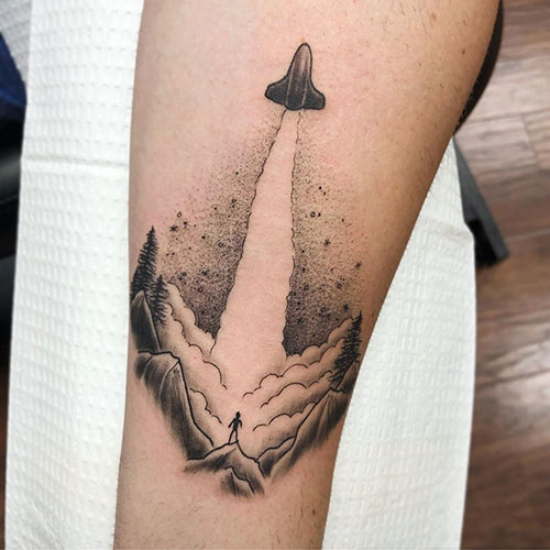 Single needle space shuttle tattoo on the inner