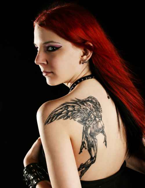 Woman with a demon slayer tattoo on her back