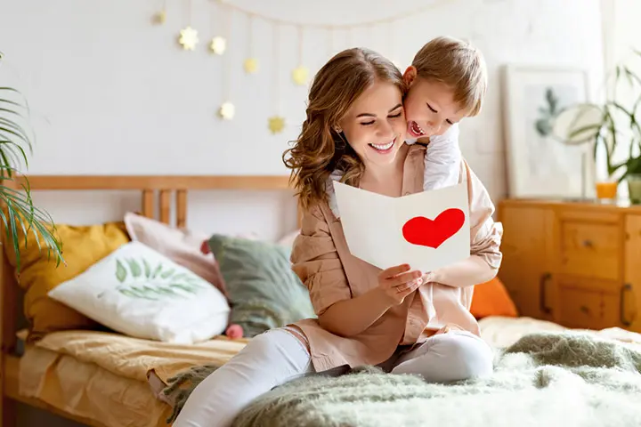 A mother and son reading a Valentine’s Day card