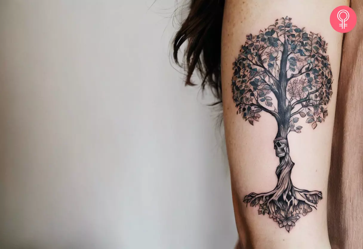 A woman with a skeleton tree of life tattoo design on her arm