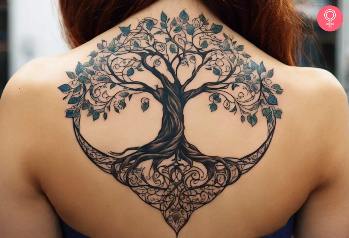 A woman with a tree of life tattoo design on her back