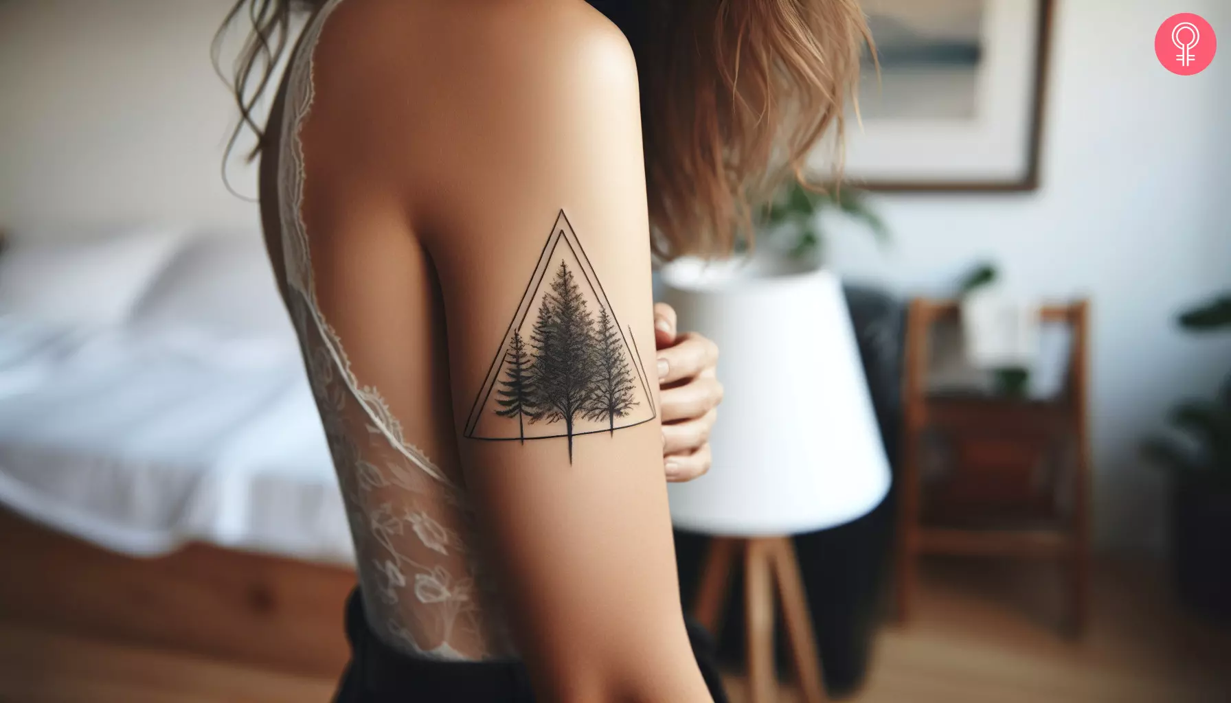 A woman with a triangle nature tattoo on her upper arm