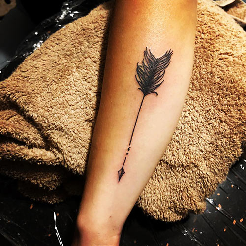 Arrow and semicolon tattoo design