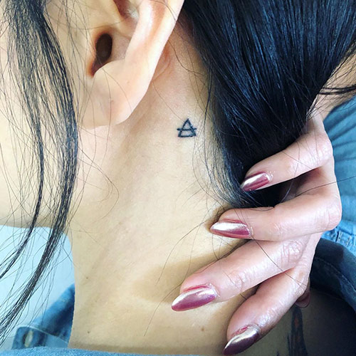Glyph triangle tattoo design
