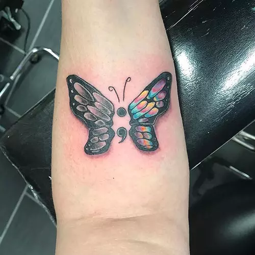 Semicolon butterfly tattoo design on wrist