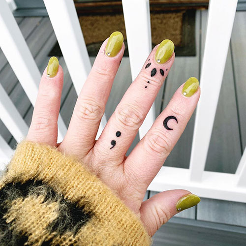 Semicolon tattoo design on finger