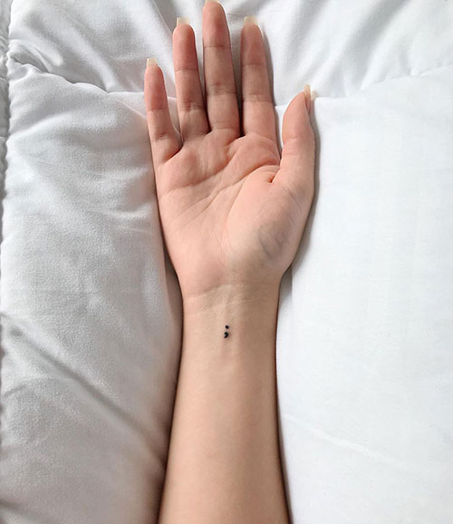 Simple semicolon tattoo design