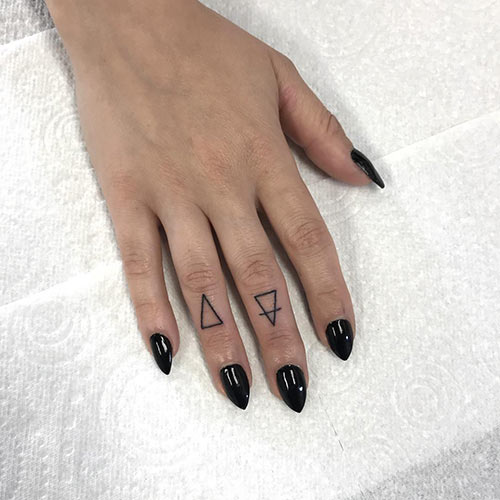 Triangle tattoo on ring finger design