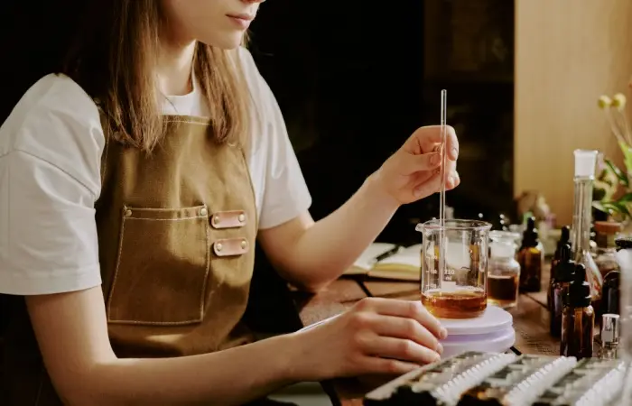 A woman making perfume