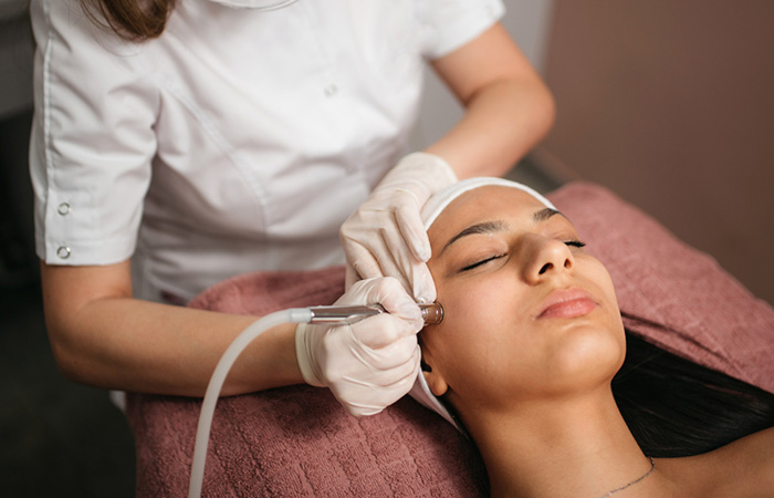 A woman getting microdermabrasion