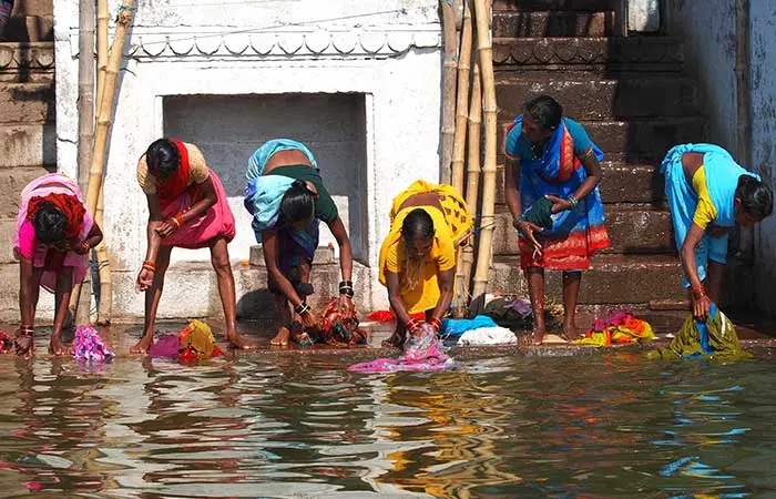Washing Up In Running Water