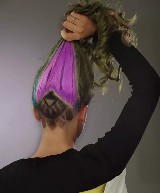 woman with blue and purple geometric undercut hairstyle