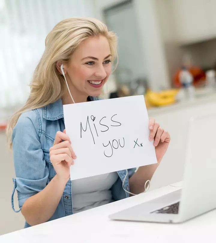 Girl showing miss you note in a video call