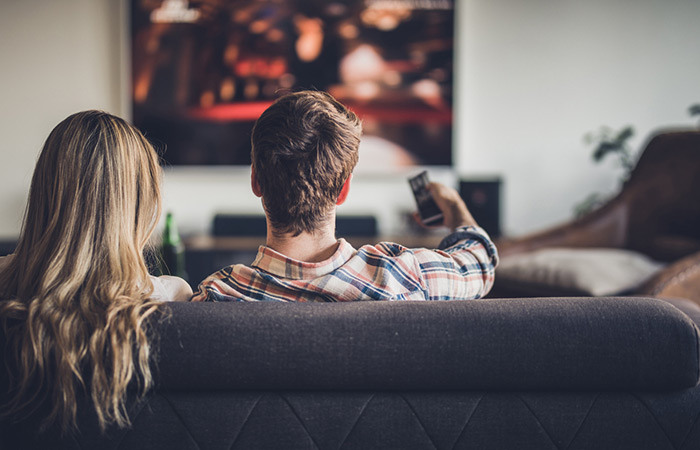 Couple watching a good movie on TV