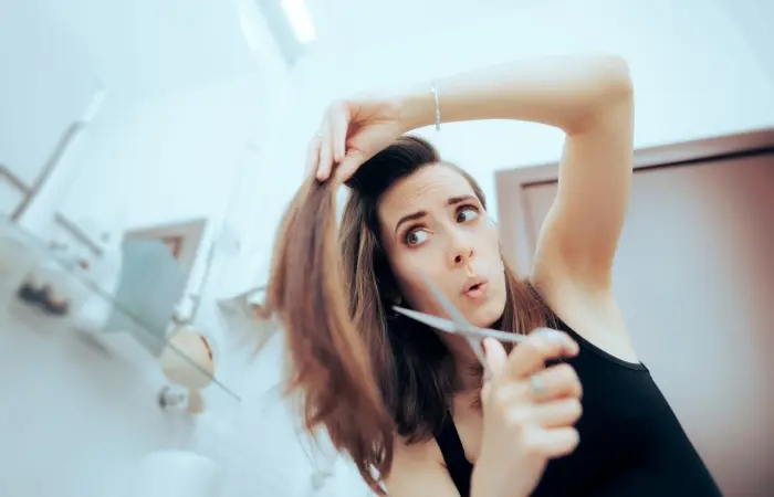 Woman trying to cut her hair at home