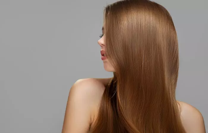 Woman with healthy and beautiful hair after applying coconut hair mask