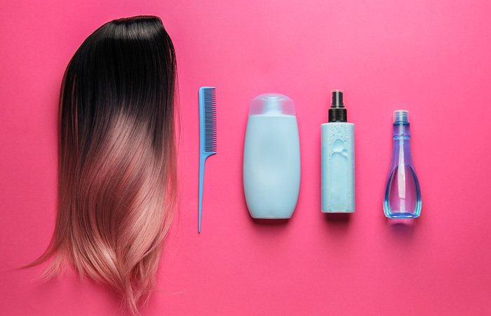 Hair extensions laid out with hair care products