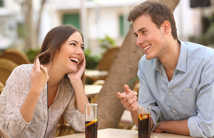 Flirt with a guy by using body language
