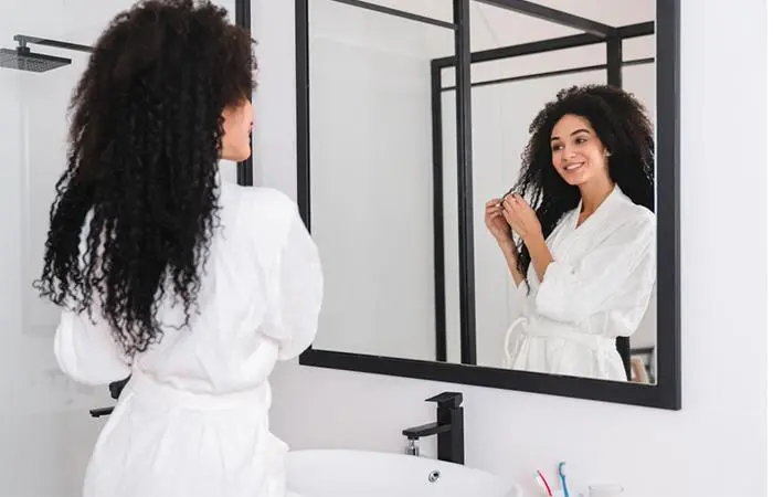 A woman air-drying her coarse hair