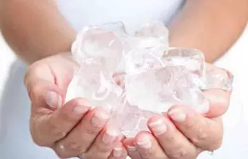 Use ice to freeze the gum and remove it. 
