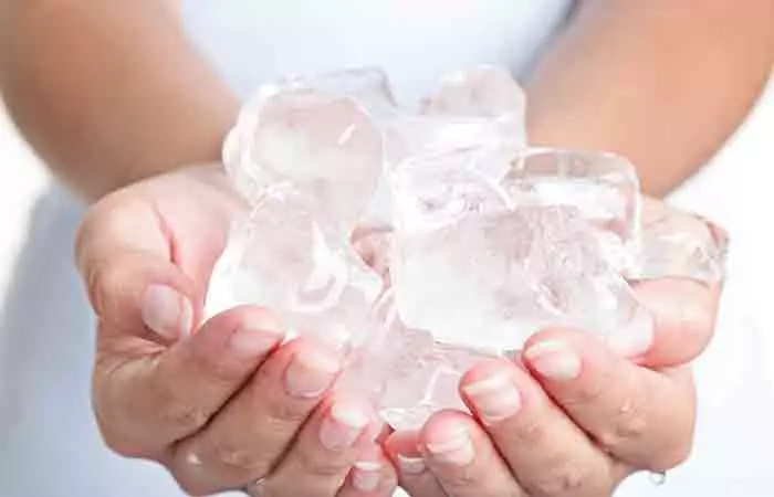 Use ice to freeze the gum and remove it. 