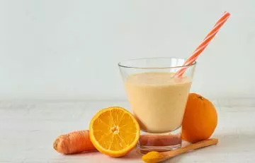 Carrot, orange, and turmeric smoothie for strengthening roots and boosting hair growth