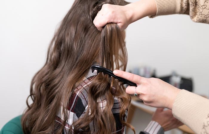 Woman getting straight perm